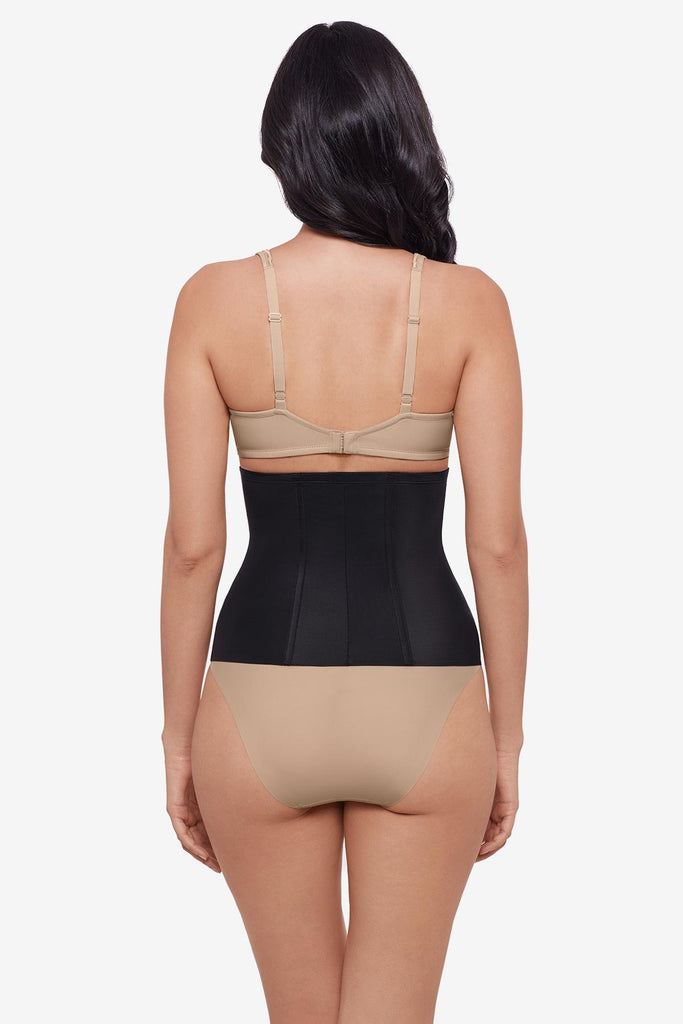 Woman faced away wearing a black waist cincher