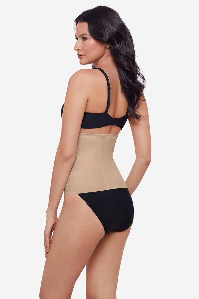 Woman turned left wearing a warm beige waist cincher