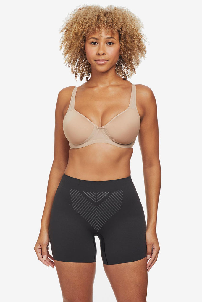 Woman wearing black bike short shapewear