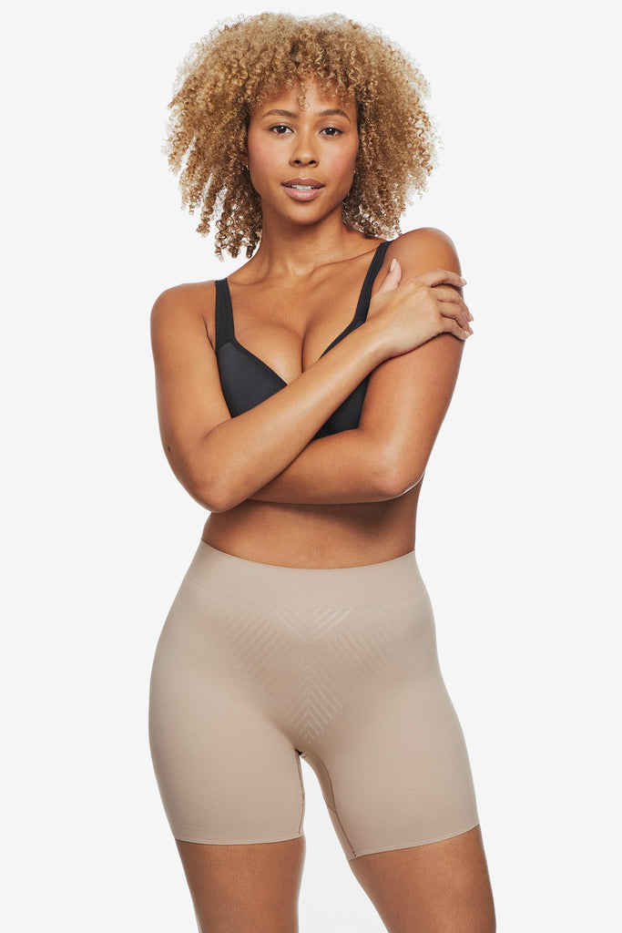 Woman wearing tan bike short shapewear
