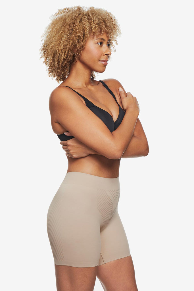 Woman wearing tan bike short shapewear