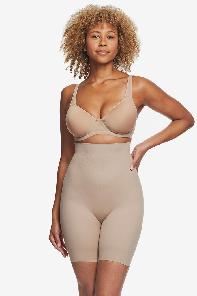Woman wearing tan high waisted bike short shapewear