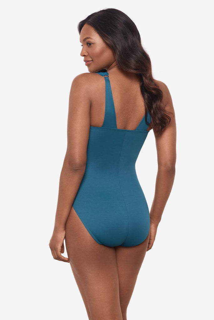 Woman turned to side to show details of one-piece swimsuit