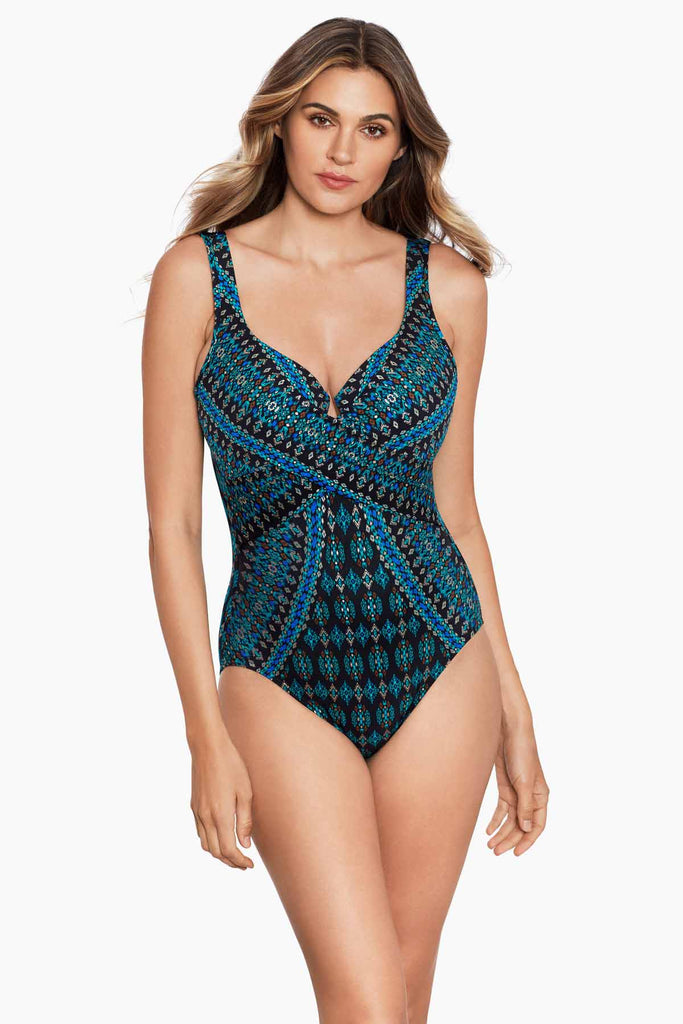 Woman wearing a one piece swim suit.