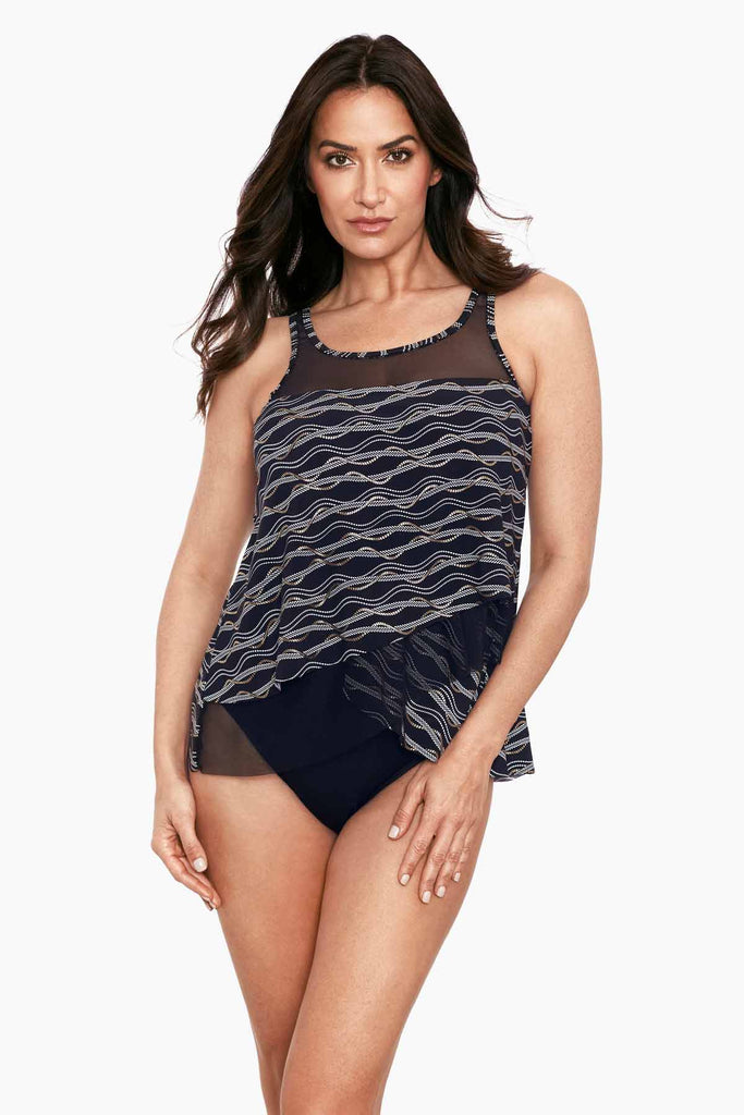 A young woman wearing a stylish tankini top.