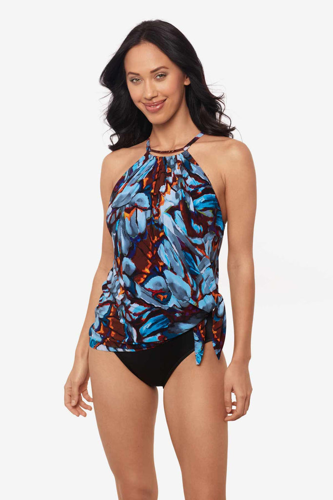 Woman wearing a multicolor one-piece swimsuit with a high neckline