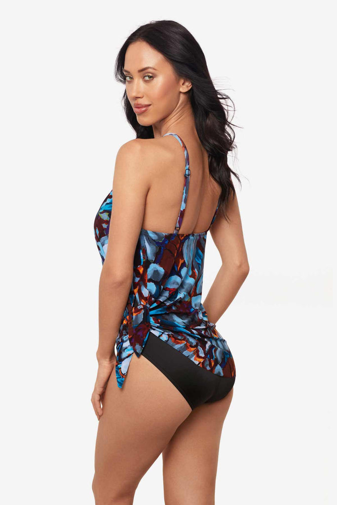 Woman faced to the left to show detail of one-piece swimsuit