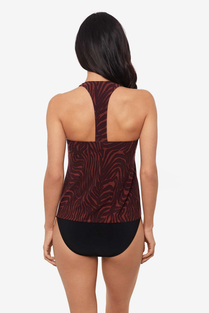 Woman facing away wearing a multicolor tankini top with a T shape back 