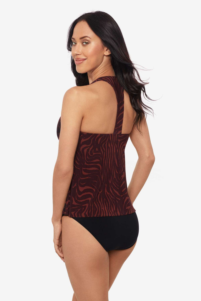Woman facing left to show off side detail of tankini swim top