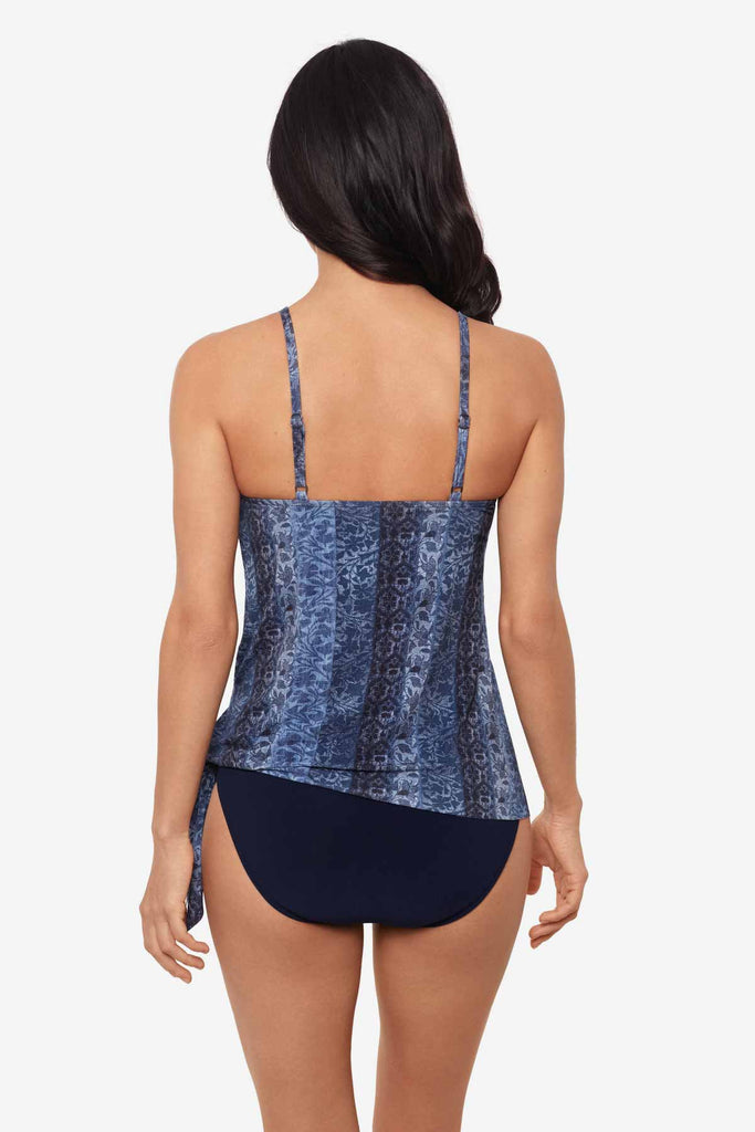 Woman turned away wearing a multicolor tankini top 