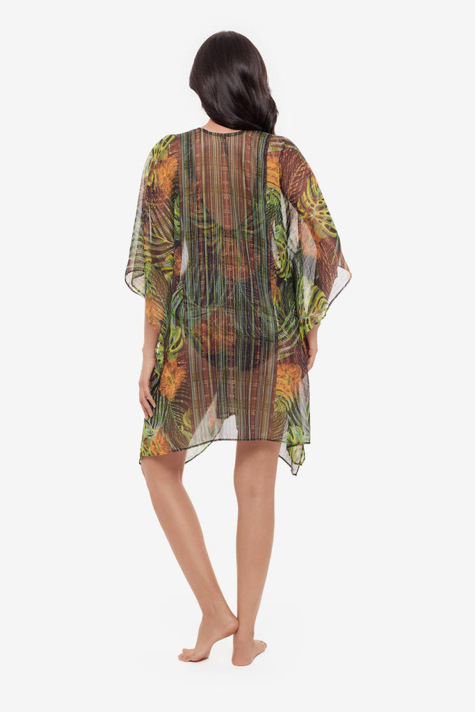 Woman turned away wearing a palm leaf printed caftan swim cover up