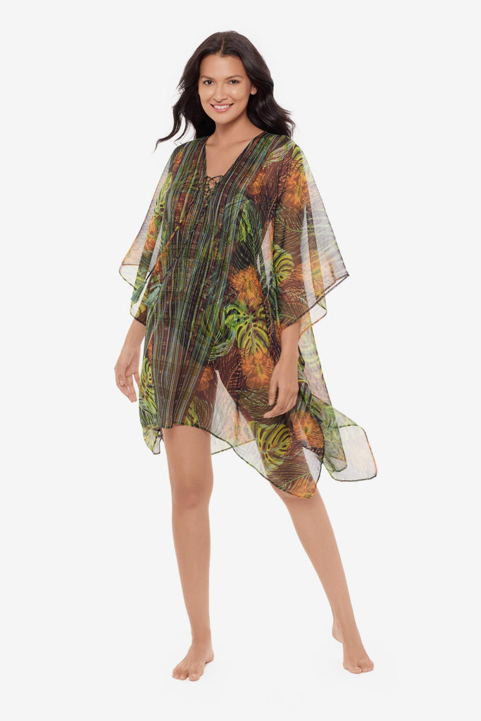 Woman wearing a palm leaf printed caftan swim cover up