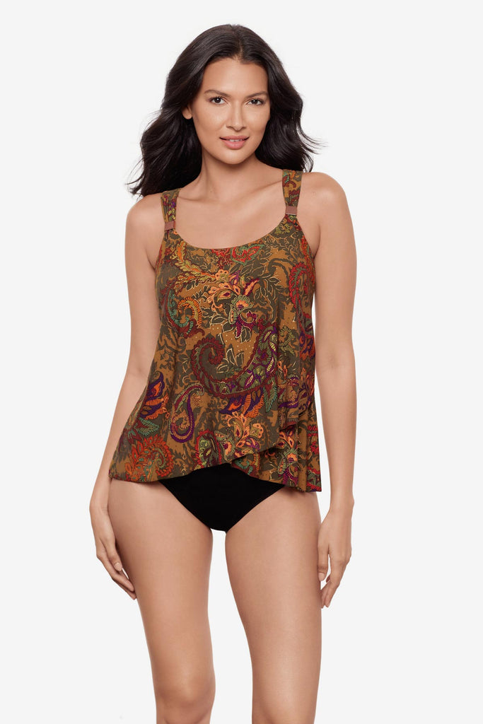 Woman wearing a multicolored paisley printed tankini top with details on the straps