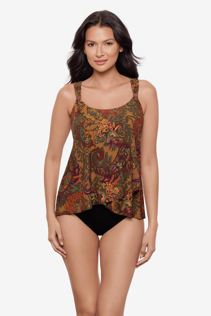 Woman wearing a multicolored paisley printed tankini top with details on the straps