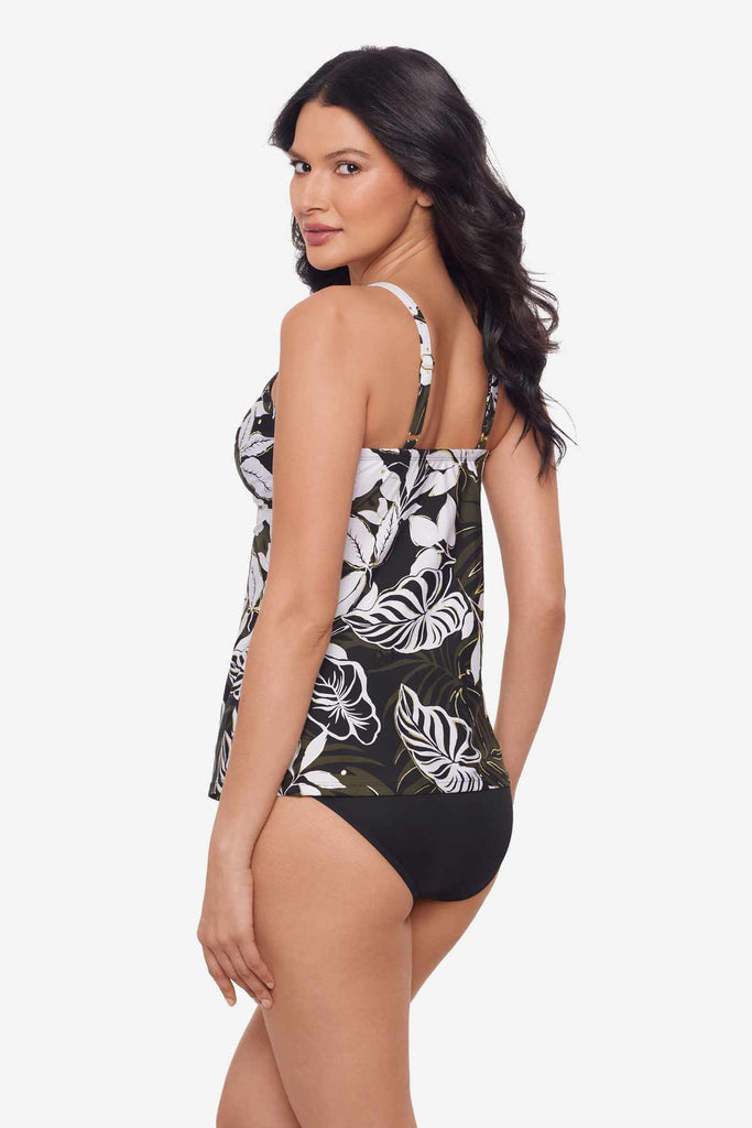 Woman facing left to show off the side of the multicolor tankini top