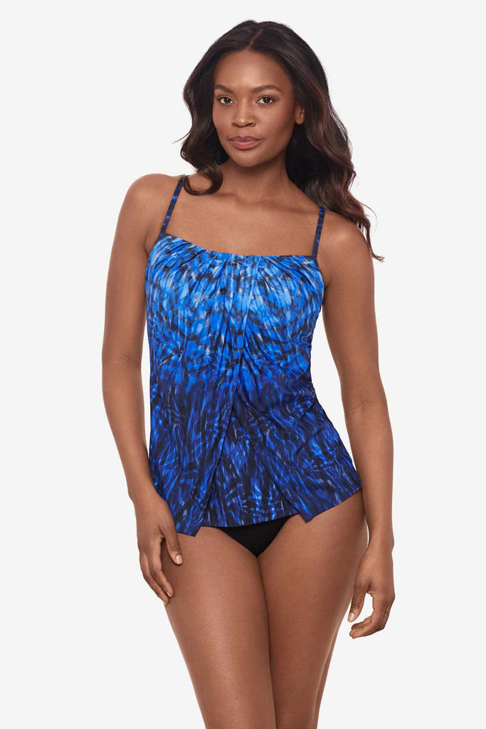 Woman wearing a black and blue tankini top with ombre effect