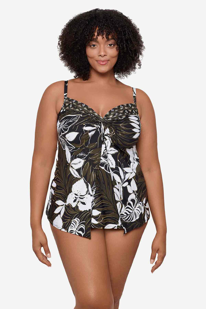 Woman wearing a multicolor tankini top with large white flowers