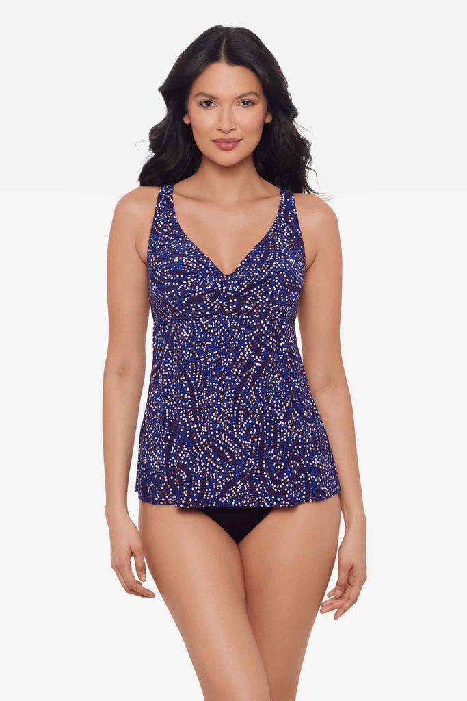 Woman wearing a multicolor tankini top with abstract dots
