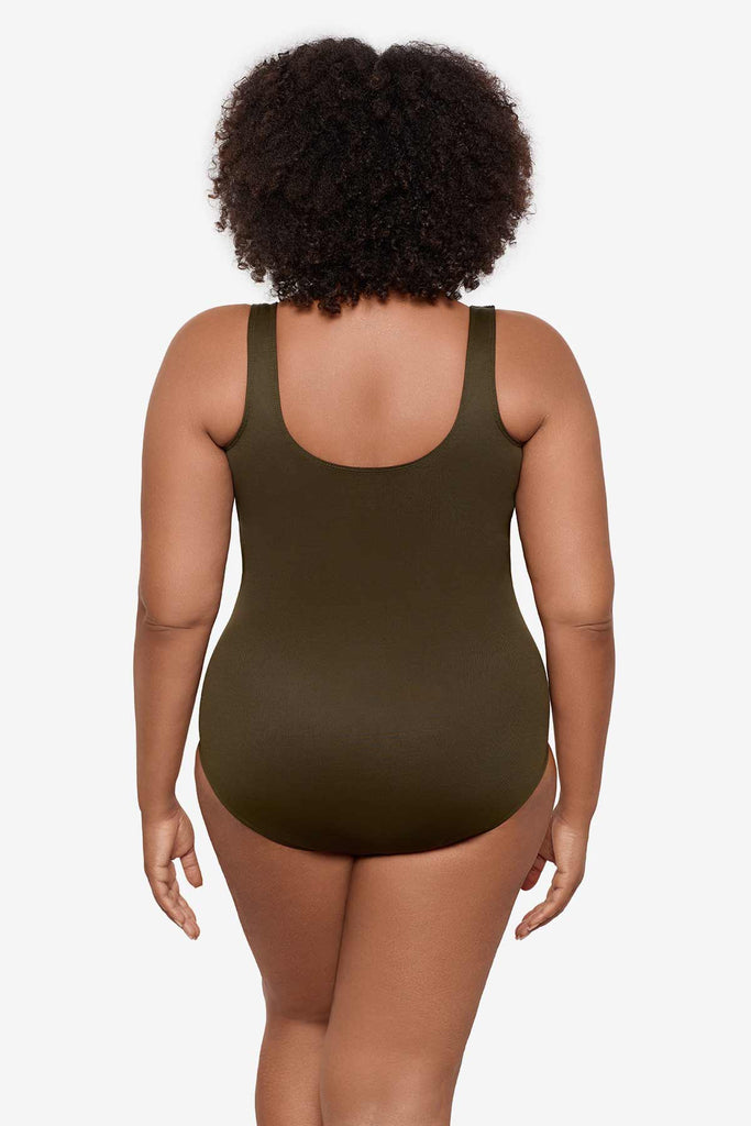 Woman turned away wearing a nori green one-piece swimsuit 