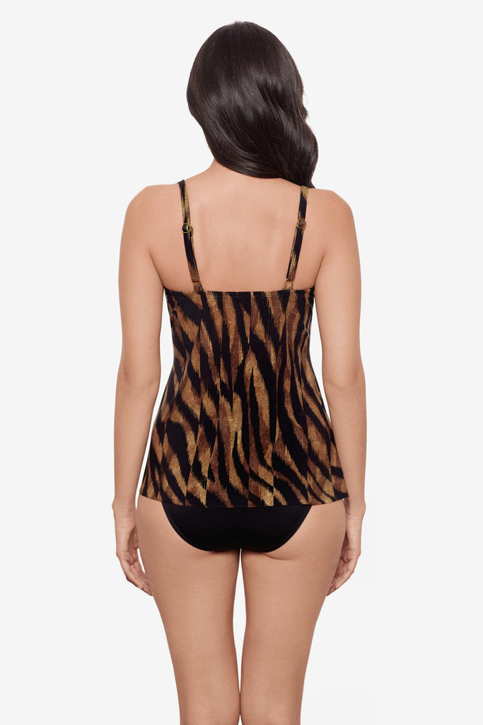 Woman turned away wearing a black and brown printed tankini top