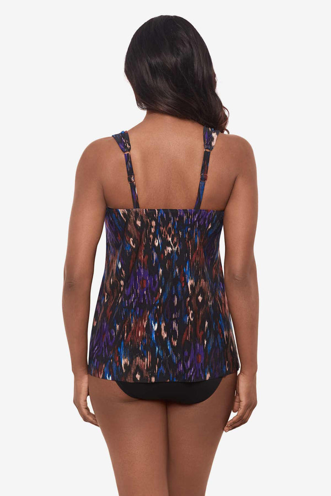 Woman facing away showing the back of the multicolored tankini top