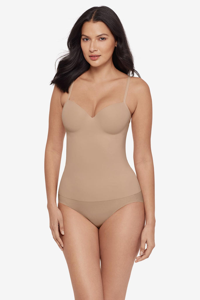 Woman wearing a tan cupped bra cami top