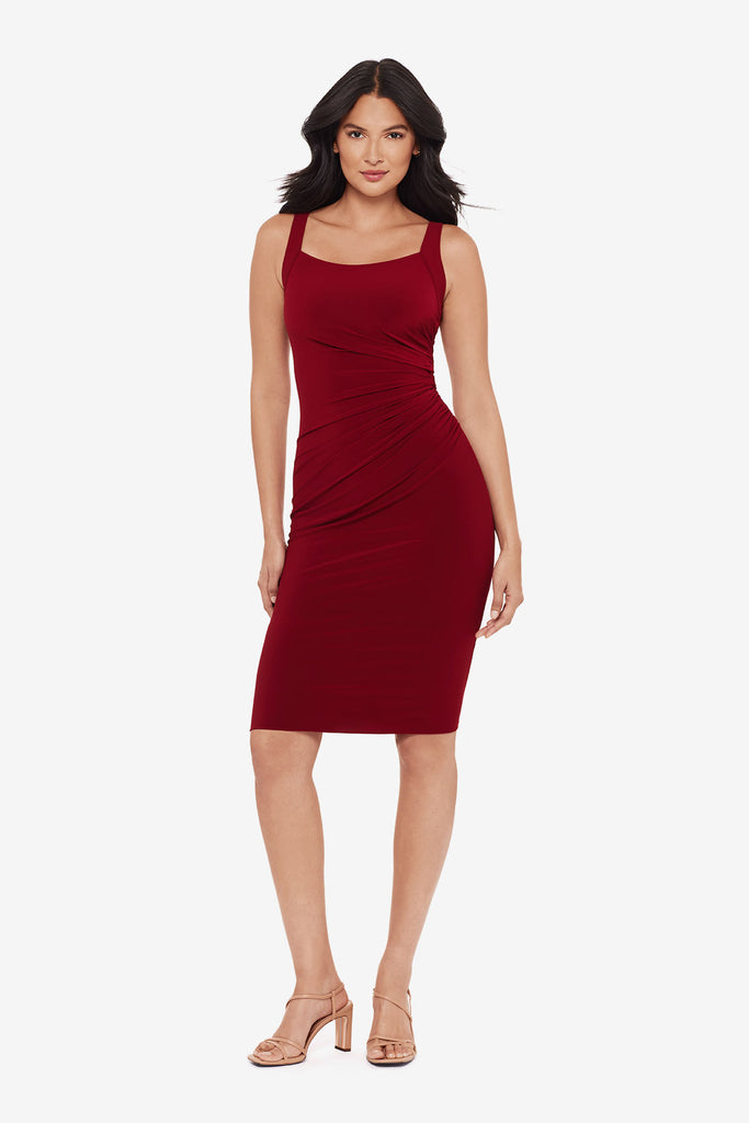 Woman wearing a crimson red midi dress with a square neckline