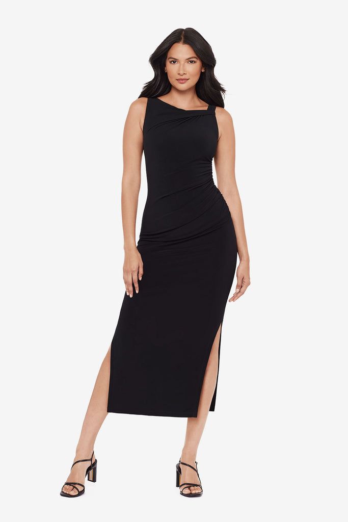 Woman wearing a black maxi dress with slits on each side 