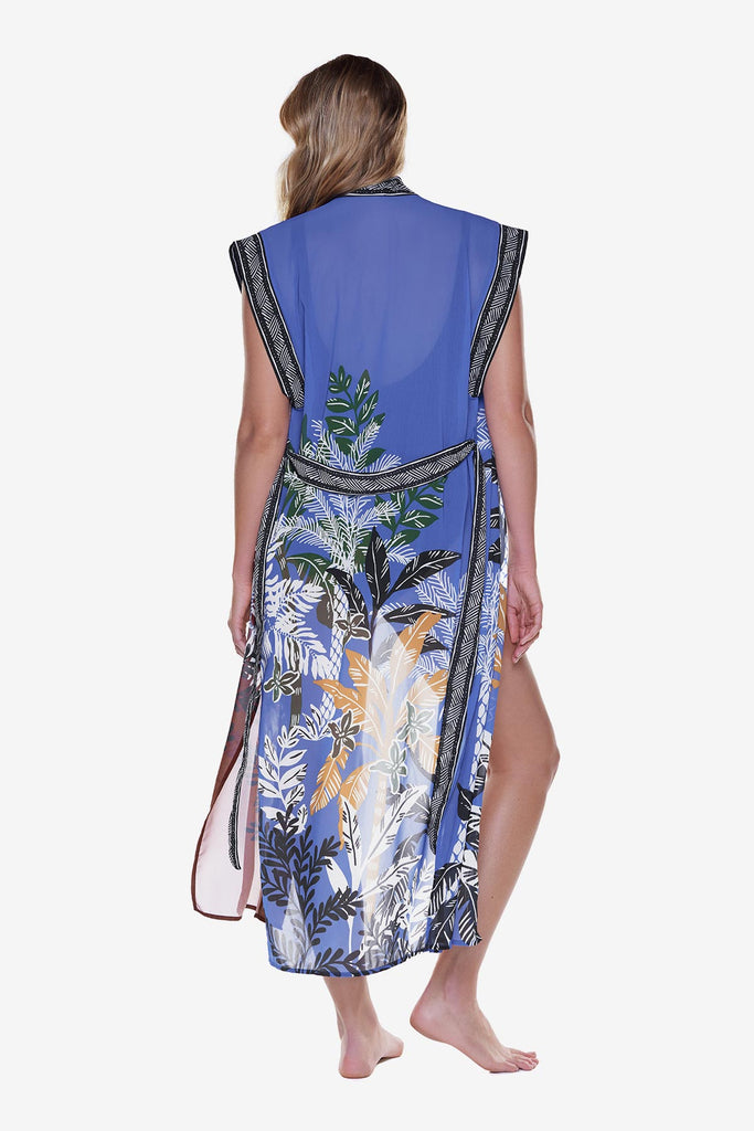 Woman turned away wearing a multicolored and printed duster swim cover up