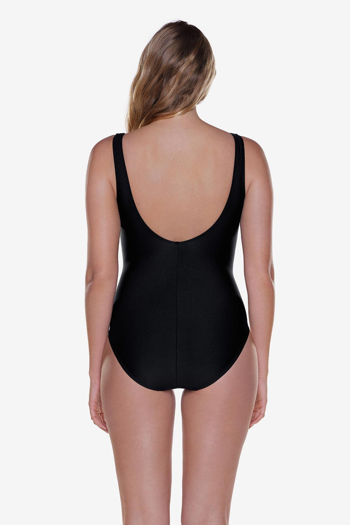 Woman turned away wearing a black one-piece swimsuit