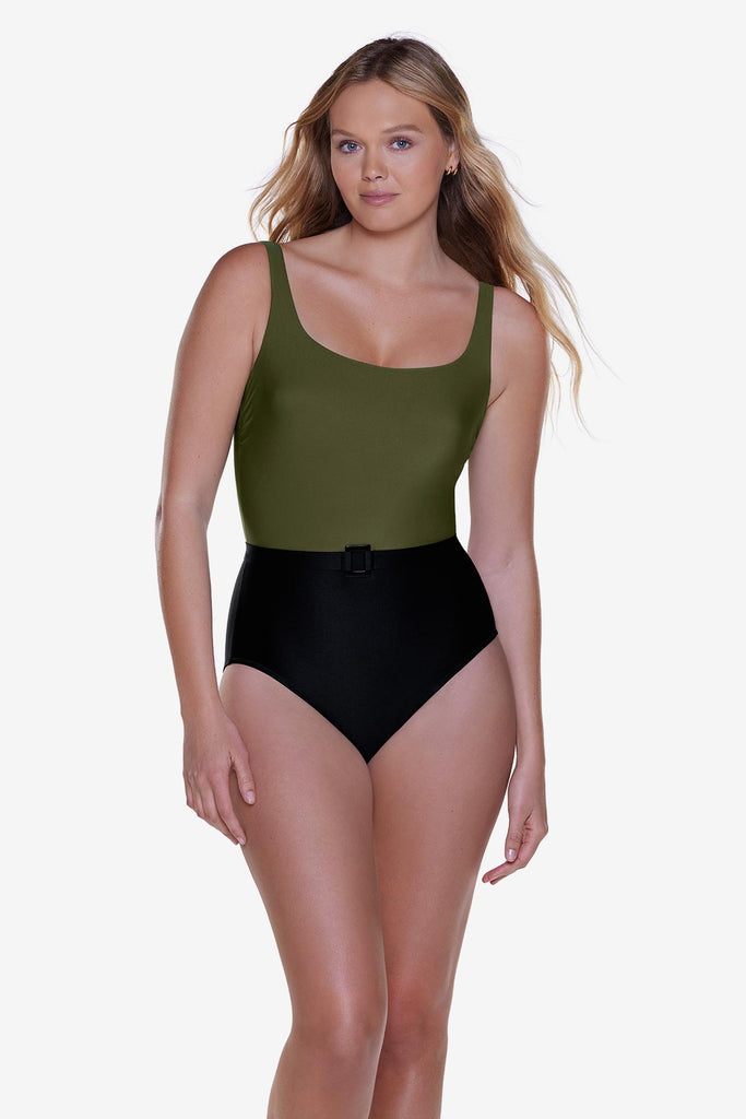 Woman wearing a green and black one piece belted swimsuit
