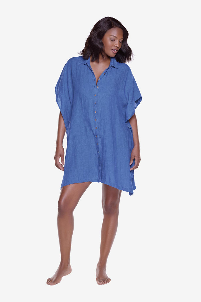 Woman wearing a blue oversized swim cover up