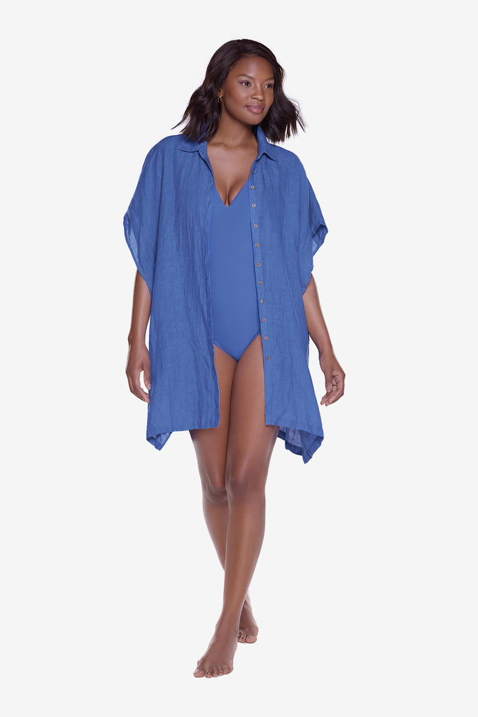 Woman wearing a blue oversized swim cover up