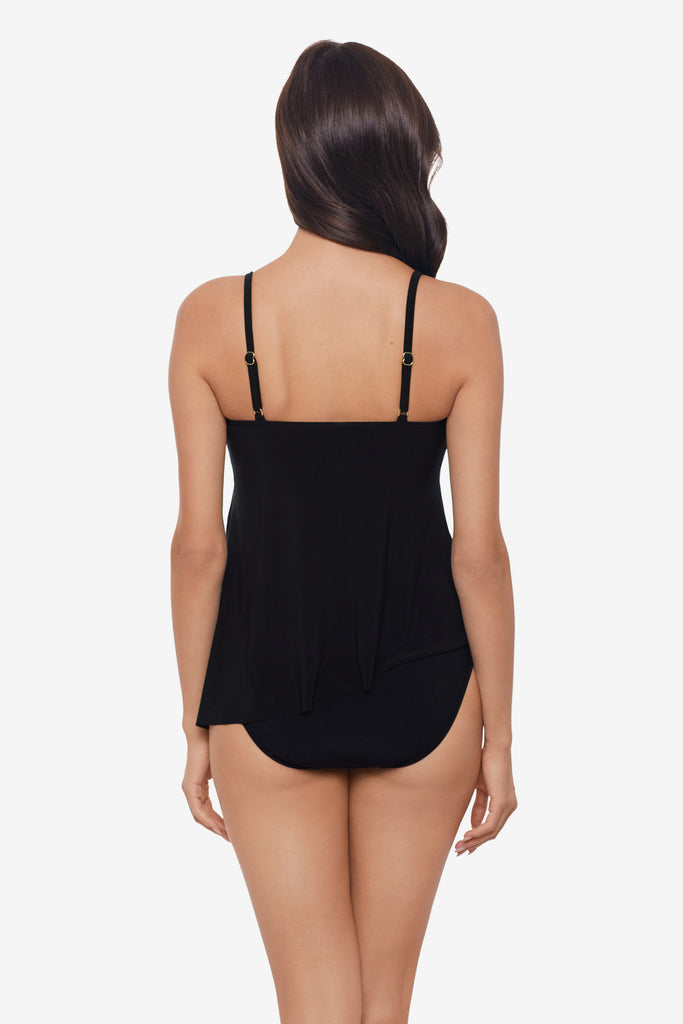 Woman faced away wearing a black tankini top