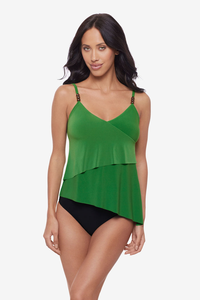Woman wearing a green layered tankini top