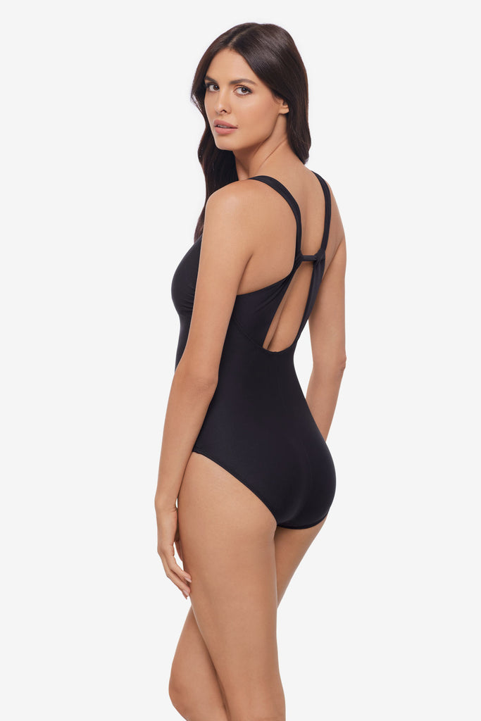 Woman turned left wearing a black one-piece swimsuit