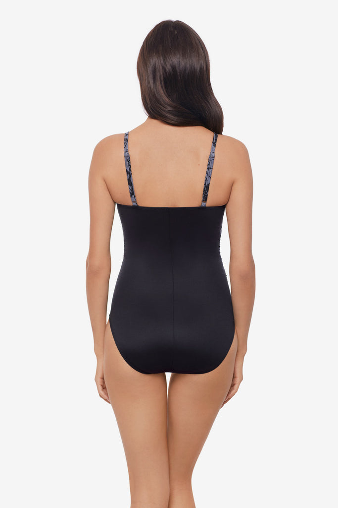 Woman turned away wearing a one-piece swimsuit 