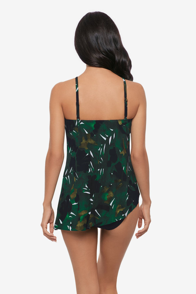 Woman turned away wearing a high neck tankini top with a palm leaf print