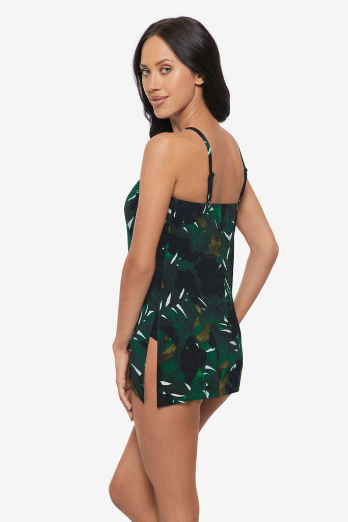 Woman turned left wearing a high neck tankini top with a palm leaf print