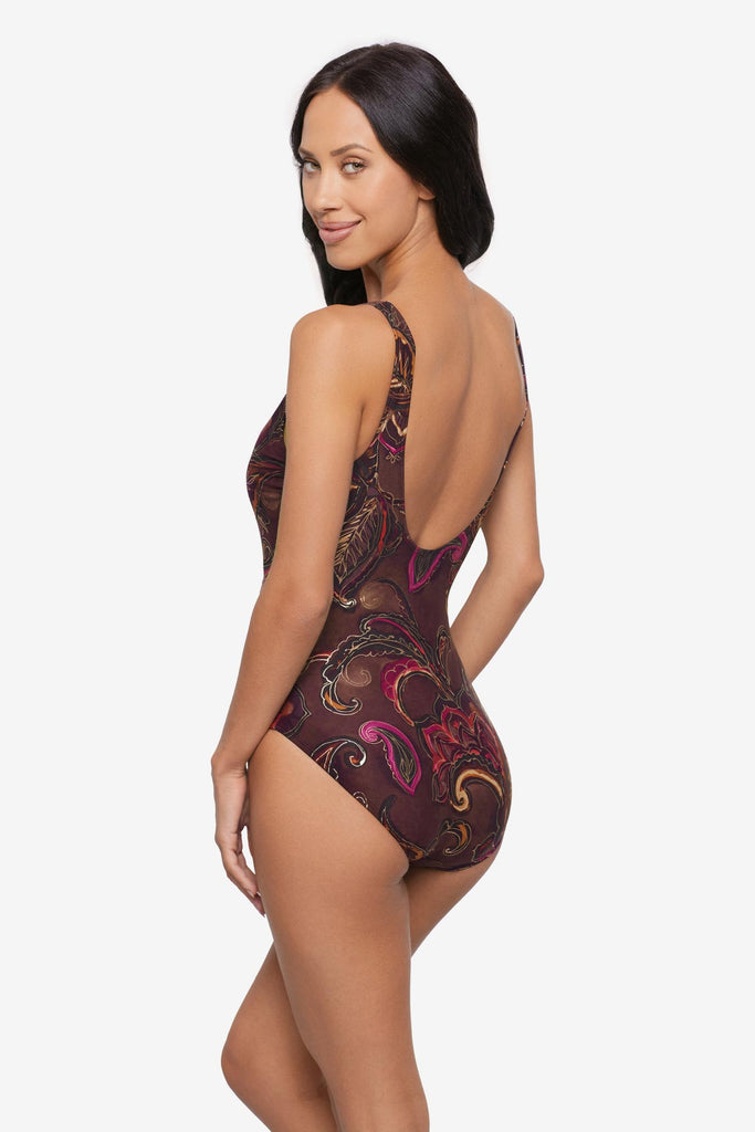 Woman turned left wearing a multicolored paisley printed one-piece swimsuit