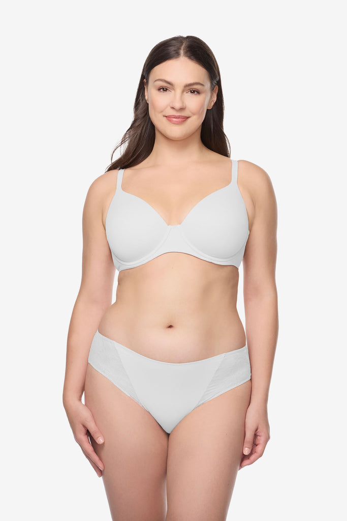Woman wearing a white bra and underwear set