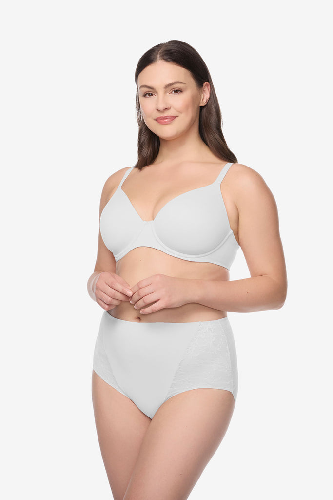 Woman wearing a white bra and high waisted underwear set