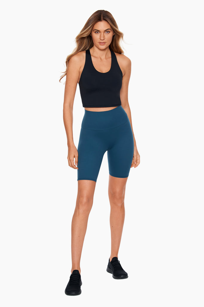 Woman wearing a miracle suit bike short.