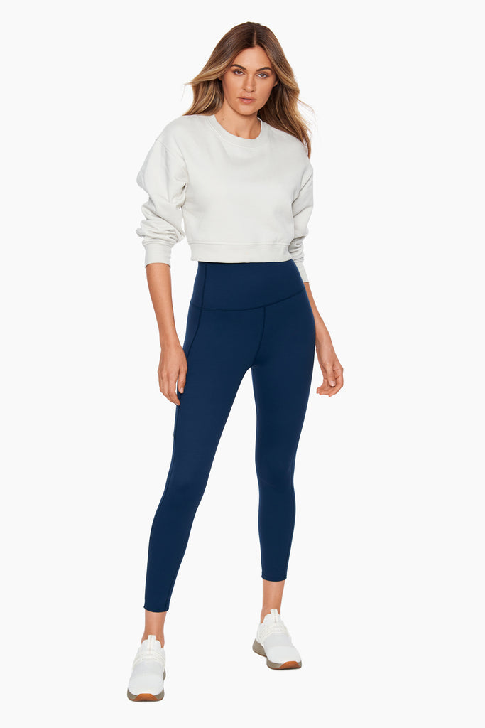 Woman wearing a full length legging.