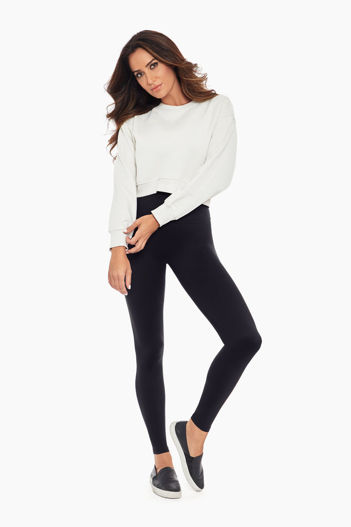 Woman in a miracle suit leggings.