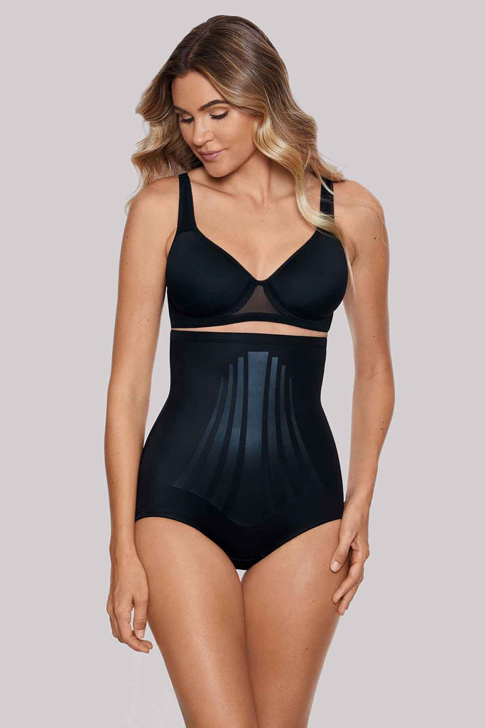 Woman wearing a high waisted shapewear.