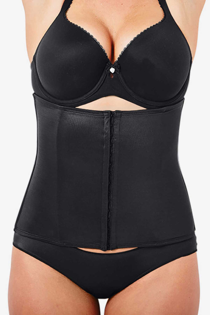 Woman in a slimming waist cincher.