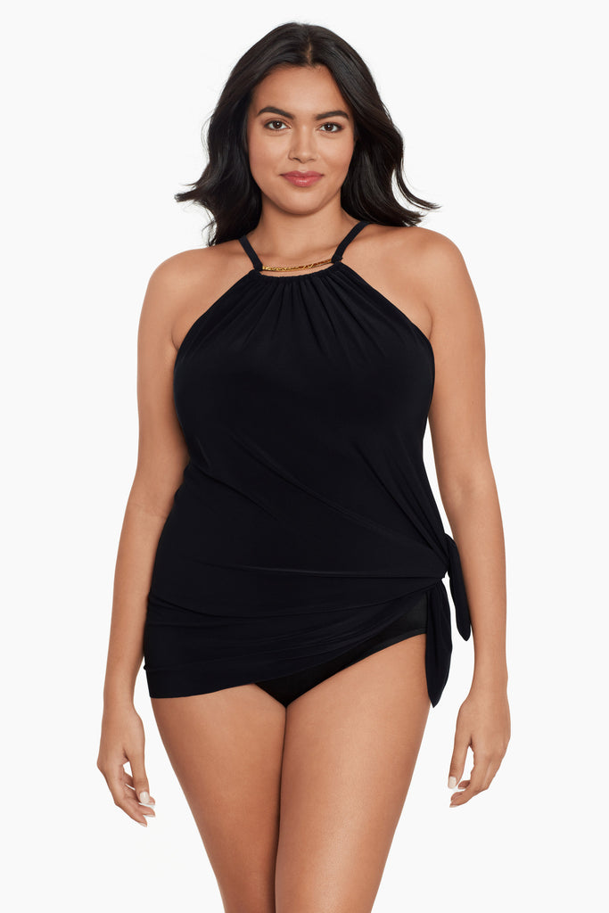 Woman in a plus size magic suit one piece swim dress.