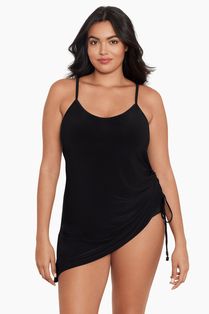 Woman wearing a plus size swim dress.