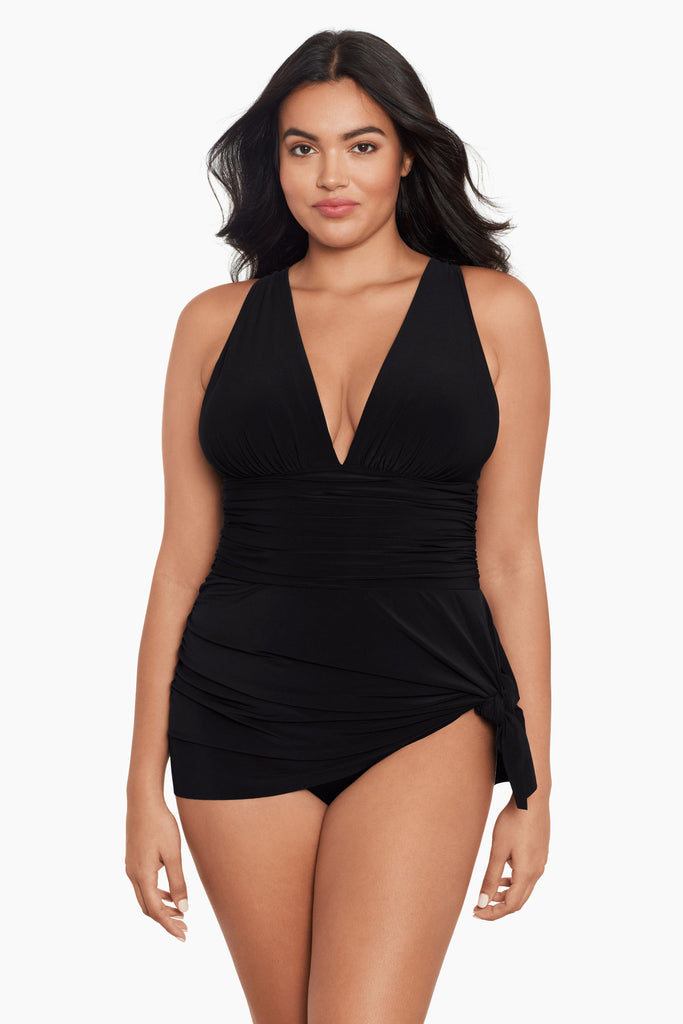 Woman wearing a plus size swim suit.